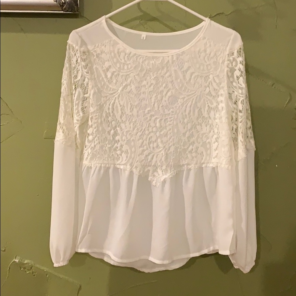 White shirt with lace overlay on the top.